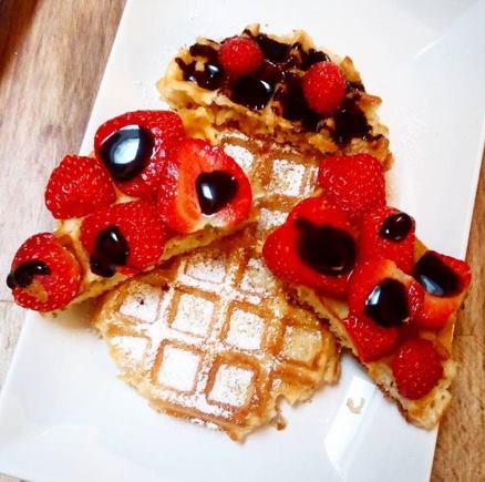 waffle with chocolate and strawberries on top in Bruges